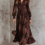 Woman wearing a paisley print zip-waist maxi dress