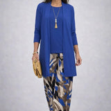 Woman wearing a patterned three-piece cardigan set with wide-leg trousers