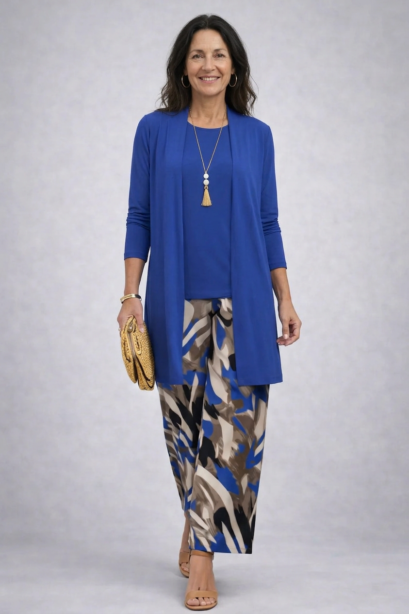 Woman wearing a blue three-piece cardigan, top and trousers co-ord set