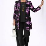 Woman wearing a purple and black three-piece cardigan, top and trousers co-ord set
