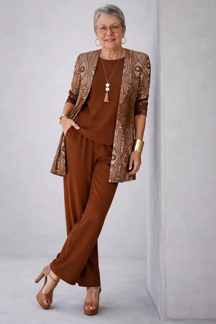 Woman wearing a patterned three-piece cardigan set with wide-leg trousers