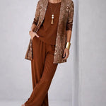 Woman wearing a patterned three-piece cardigan set with wide-leg trousers