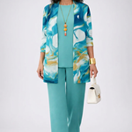 Woman wearing a turquoise three-piece cardigan, top and trousers co-ord set