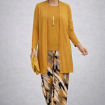 Woman wearing a yellow three-piece cardigan, top and trousers co-ord set