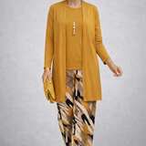Woman wearing a yellow three-piece cardigan, top and trousers co-ord set
