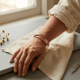 Woman wearing a grooved copper cuff