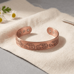 Copper cuff bracelet with hand-stamped tractor pattern