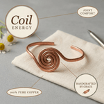 Spiral copper anklet with a hand-coiled centre design