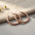 Wrapped teardrop copper earrings with coiled detail