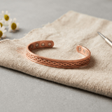 Copper cuff bracelet with an infinity pattern and hidden magnets