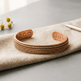 Woman wearing a braided magnetic copper bracelet