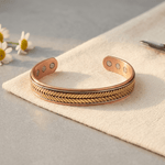 Copper cuff bracelet with a hand-pressed chevron braid pattern