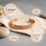 Woman wearing a leaf cut-out copper cuff
