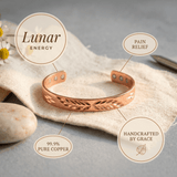 Woman wearing a leaf cut-out copper cuff