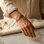 Copper cuff bracelet with a hand-engraved botanical pattern