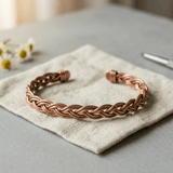 Braided copper anklet with an even, hand-woven pattern