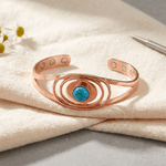 Woman wearing a turquoise and copper bracelet