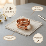 Woman wearing a triple coil copper ring