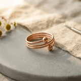 Woman wearing a triple coil copper ring