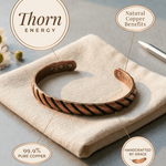 Copper cuff bracelet with a ridged texture and hidden magnets