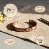 Copper cuff bracelet with hand-engraved vines and flowers