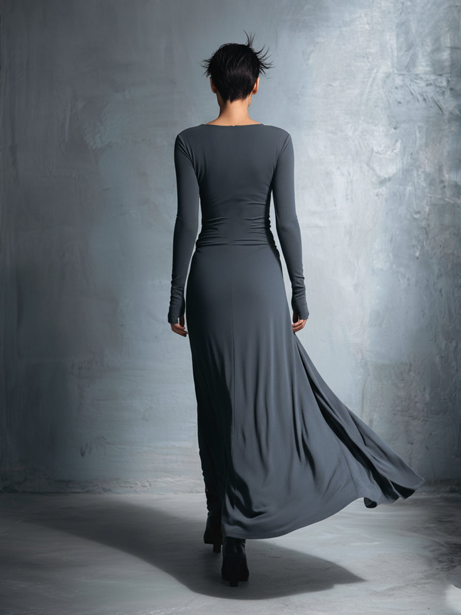 Woman wearing a long-sleeve maxi dress with an adjustable side tie