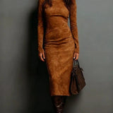 Woman wearing a suede-effect high-neck midi dress