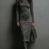 Woman wearing a suede-effect high-neck midi dress