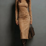 Woman wearing a suede-effect high-neck midi dress