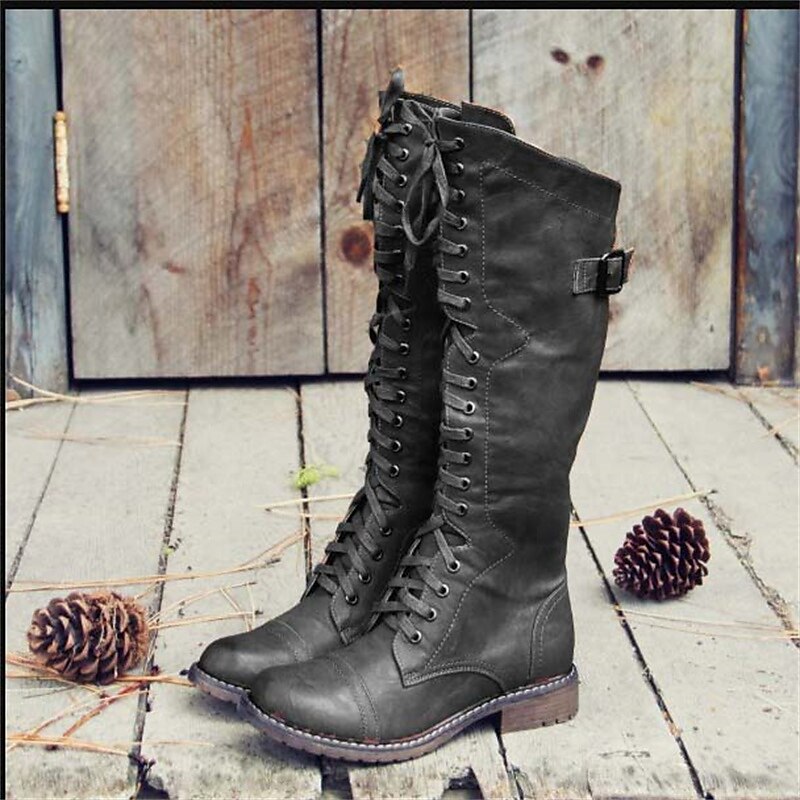 Beatrice lace-up leather riding boots in black, lifestyle shot
