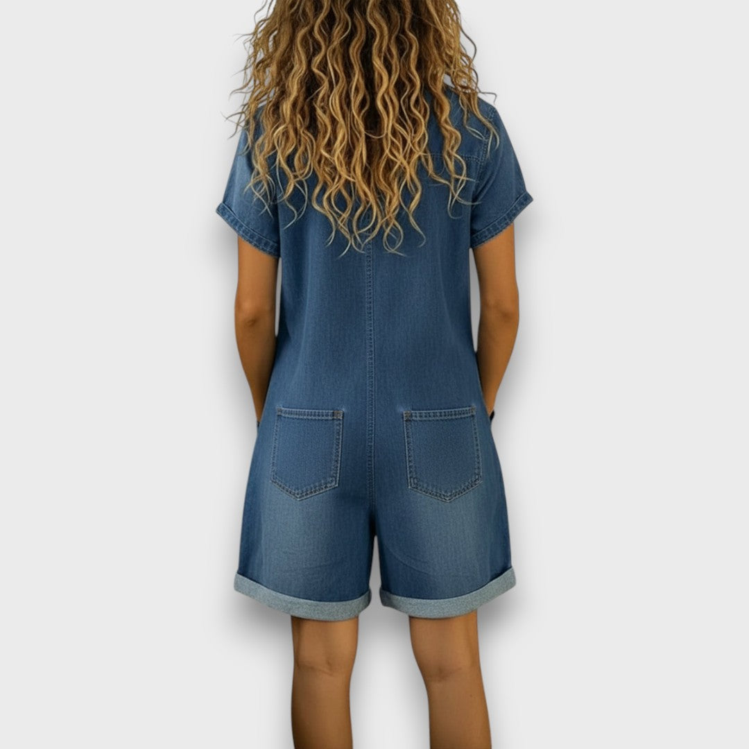 Woman wearing a short vintage cotton jumpsuit with a denim-effect finish