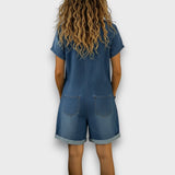Woman wearing a short vintage cotton jumpsuit with a denim-effect finish
