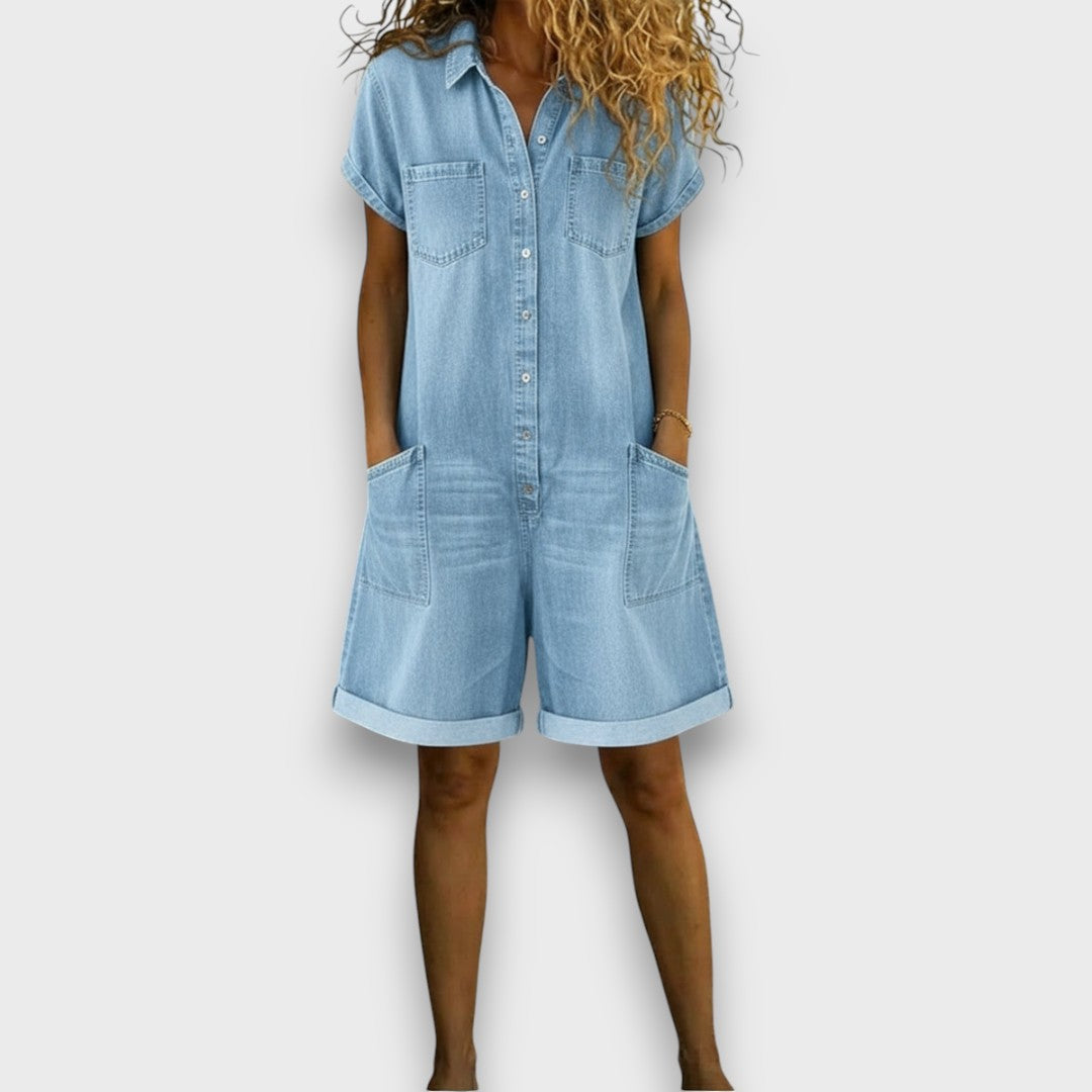 Woman wearing a short vintage cotton jumpsuit with a denim-effect finish