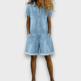 Woman wearing a short vintage cotton jumpsuit with a denim-effect finish