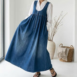 Woman wearing a long vintage-inspired denim maxi dress