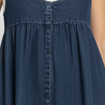 Woman wearing a long vintage-inspired denim maxi dress