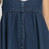 Woman wearing a long vintage-inspired denim maxi dress