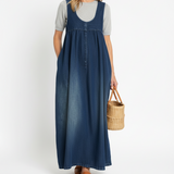 Woman wearing a long vintage-inspired denim maxi dress