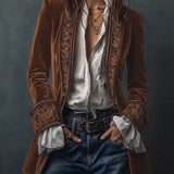 Woman wearing a long embroidered velvet jacket