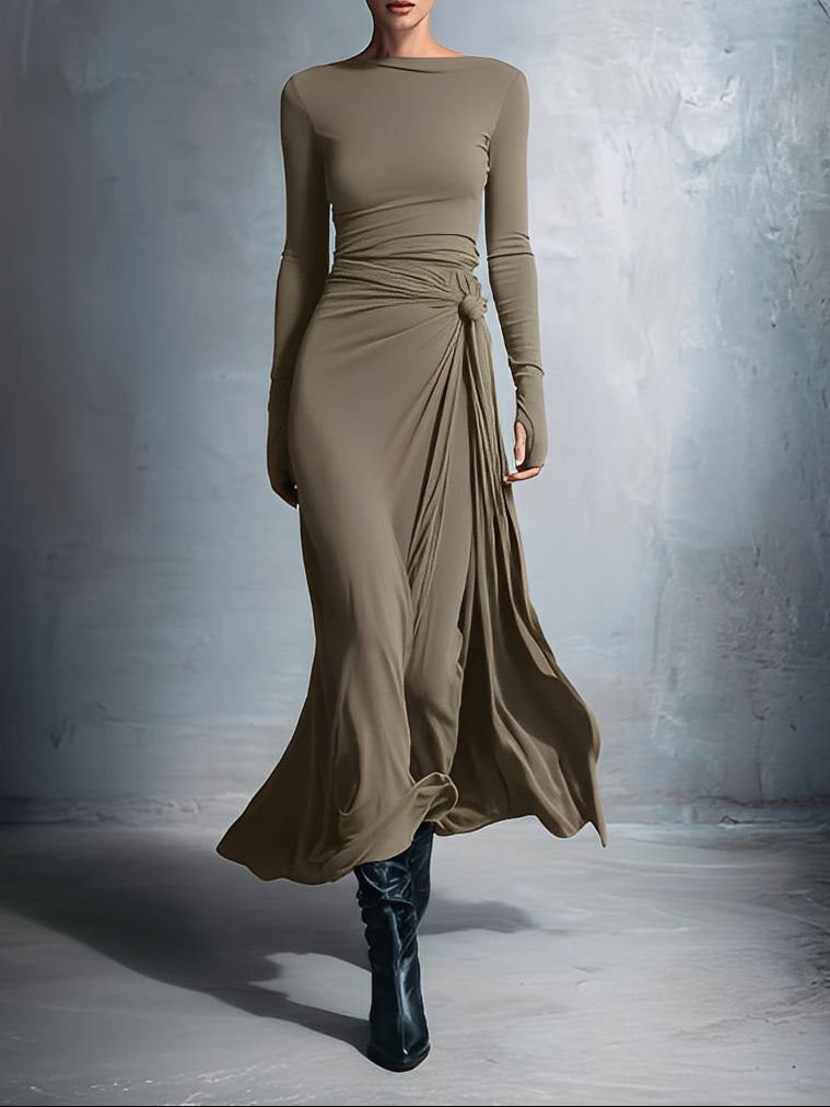 Woman wearing a long-sleeve maxi dress with an adjustable side tie