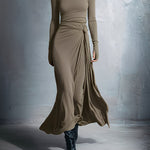Woman wearing a long-sleeve maxi dress with an adjustable side tie