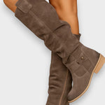 Adelaide brown suede knee-high boots worn on leg