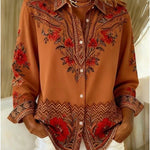 Woman wearing a terracotta floral print blouse