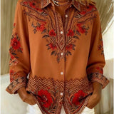 Woman wearing a terracotta floral print blouse